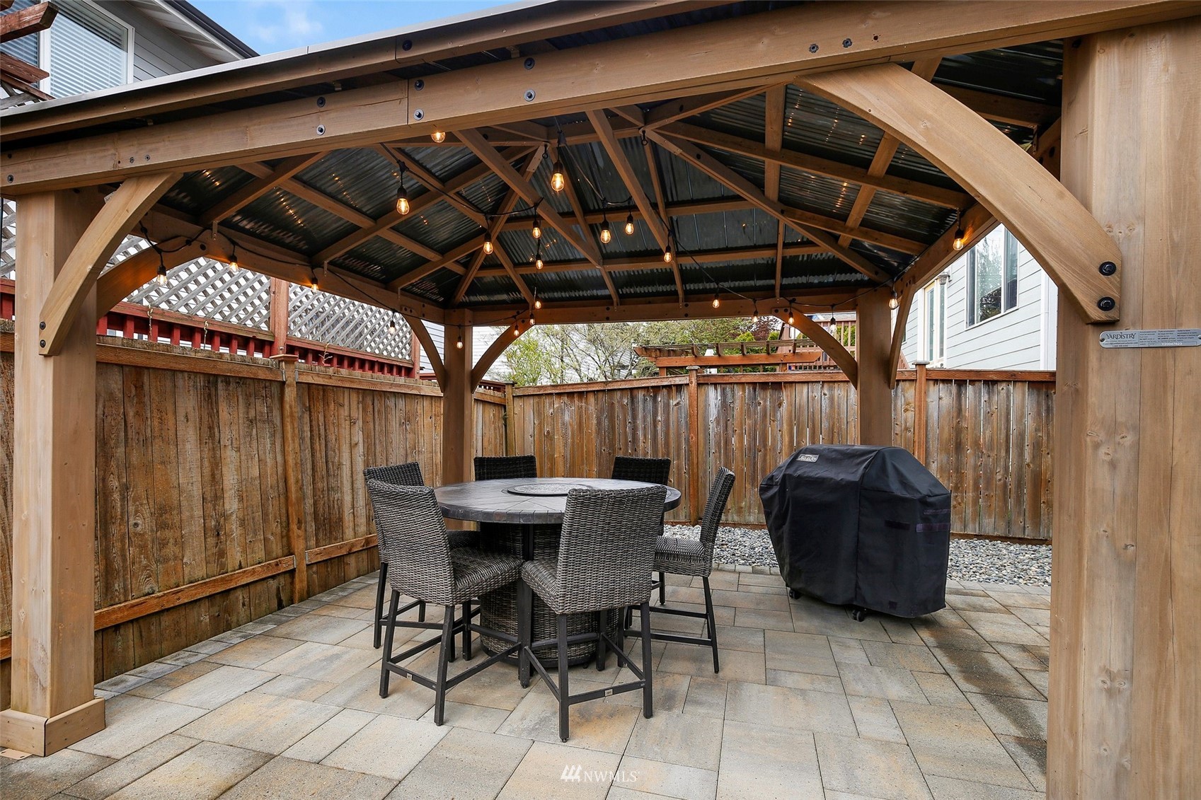 4127 Northeast 5th Court Renton, WA 98059 - Photo 14 of 36 a view of a backyard with table and chairs with wooden floor
