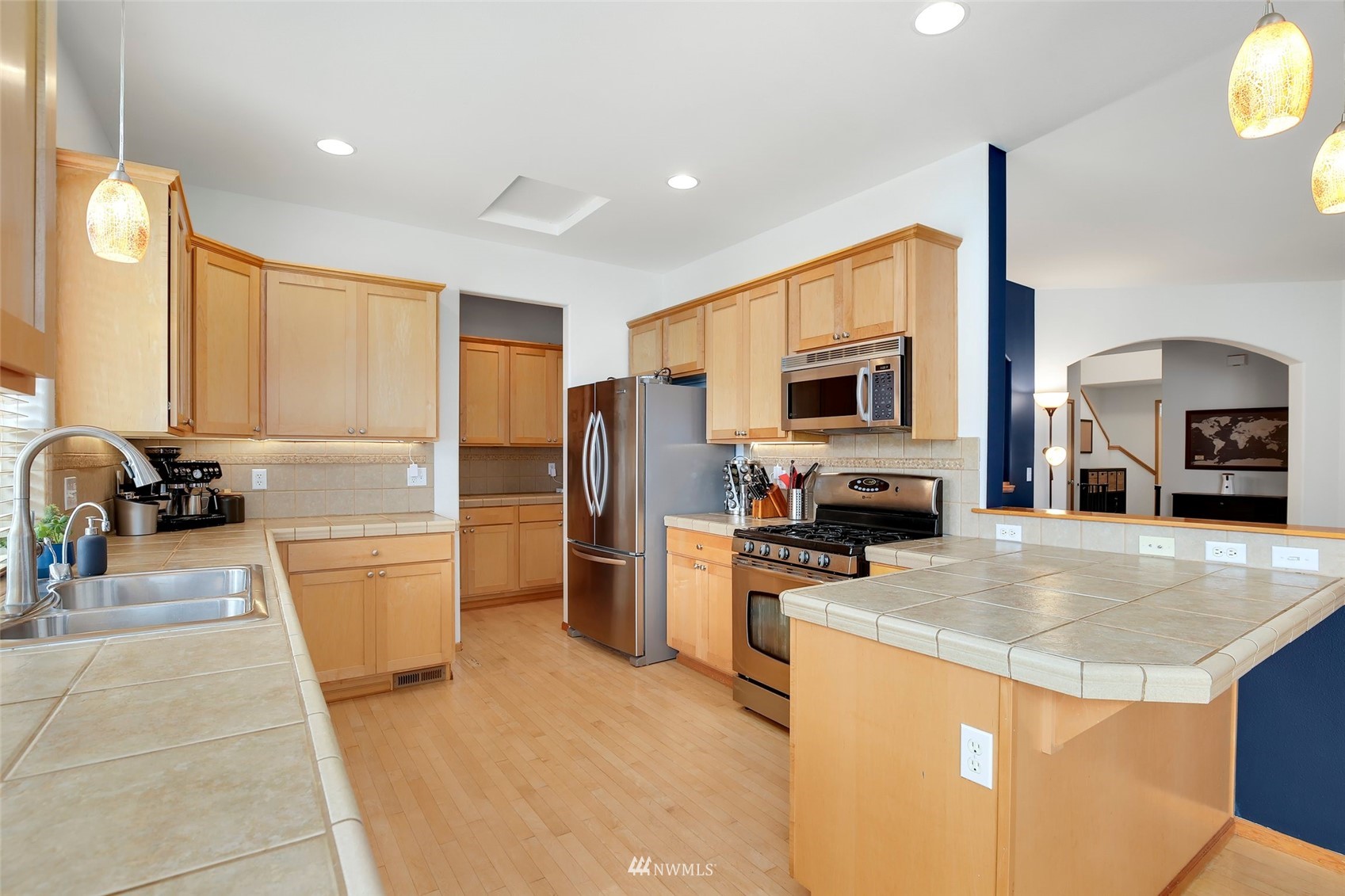 4127 Northeast 5th Court Renton, WA 98059 - Photo 18 of 36 a kitchen with refrigerator and stove
