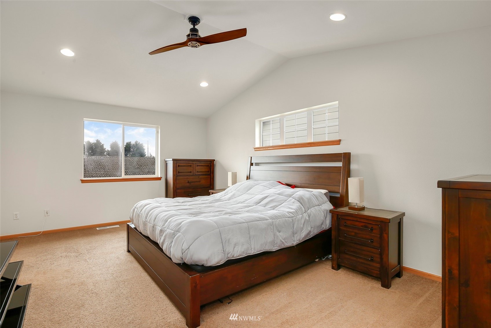4127 Northeast 5th Court Renton, WA 98059 - Photo 24 of 36 a bedroom with a bed and window