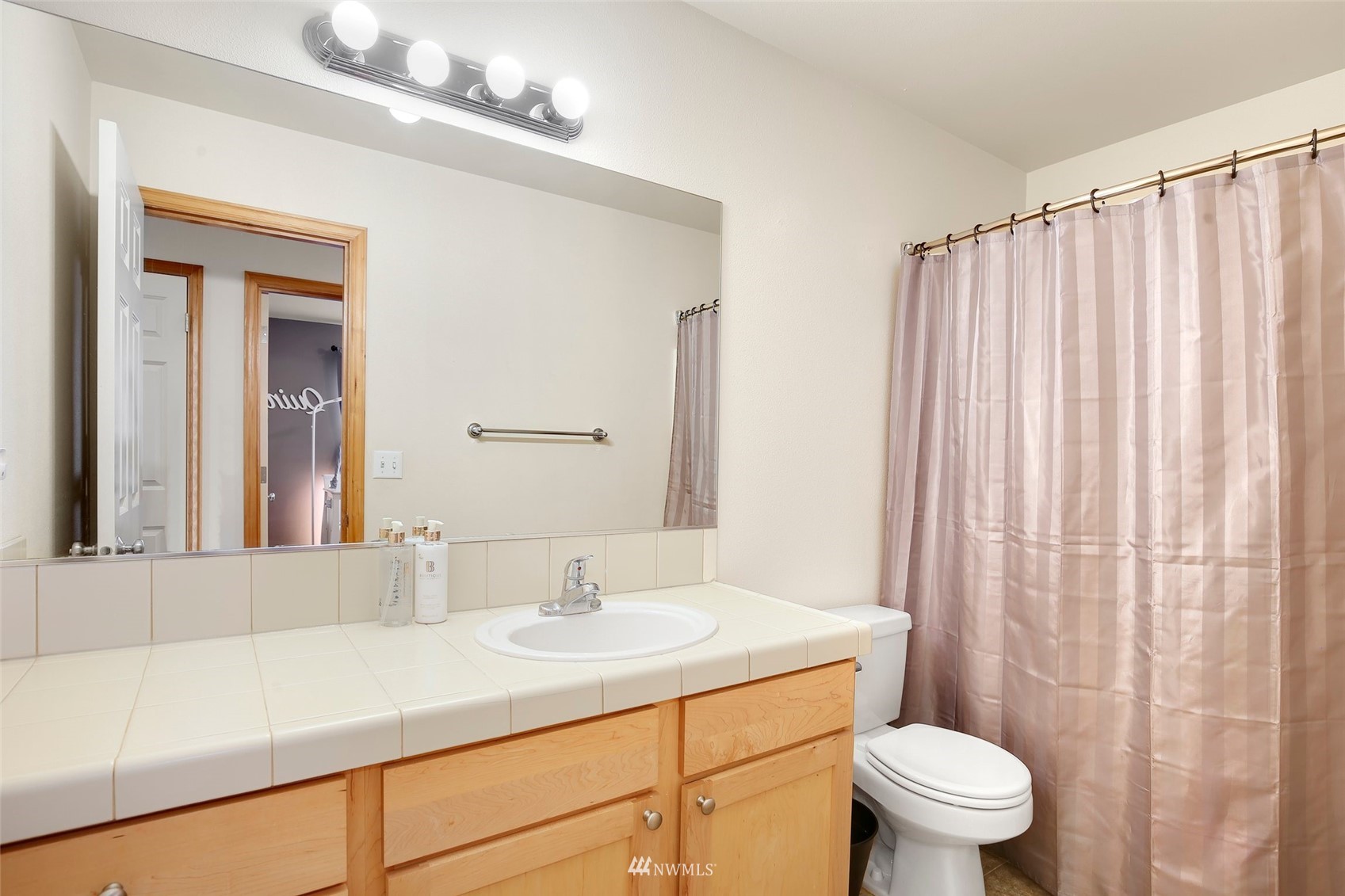 4127 Northeast 5th Court Renton, WA 98059 - Photo 31 of 36 a bathroom with a sink toilet and shower