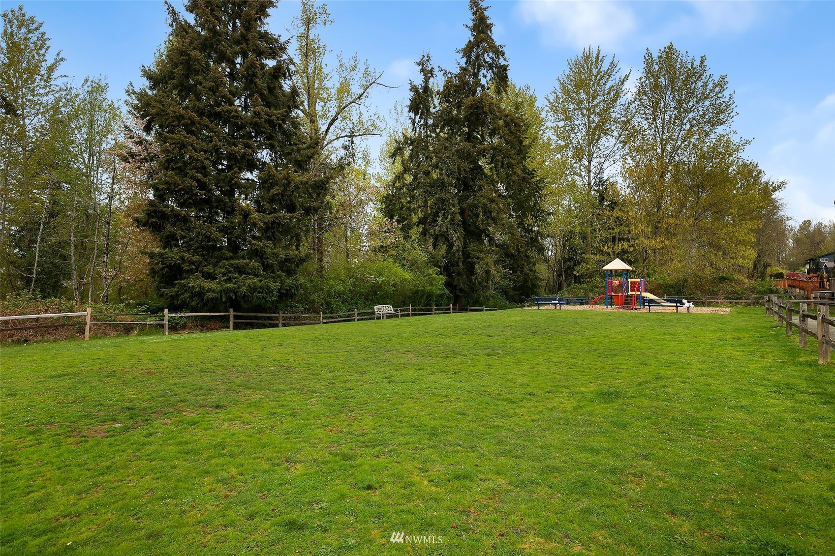 4127 Northeast 5th Court Renton, WA 98059 - Photo 34 of 36 a green field with lots of trees in the background