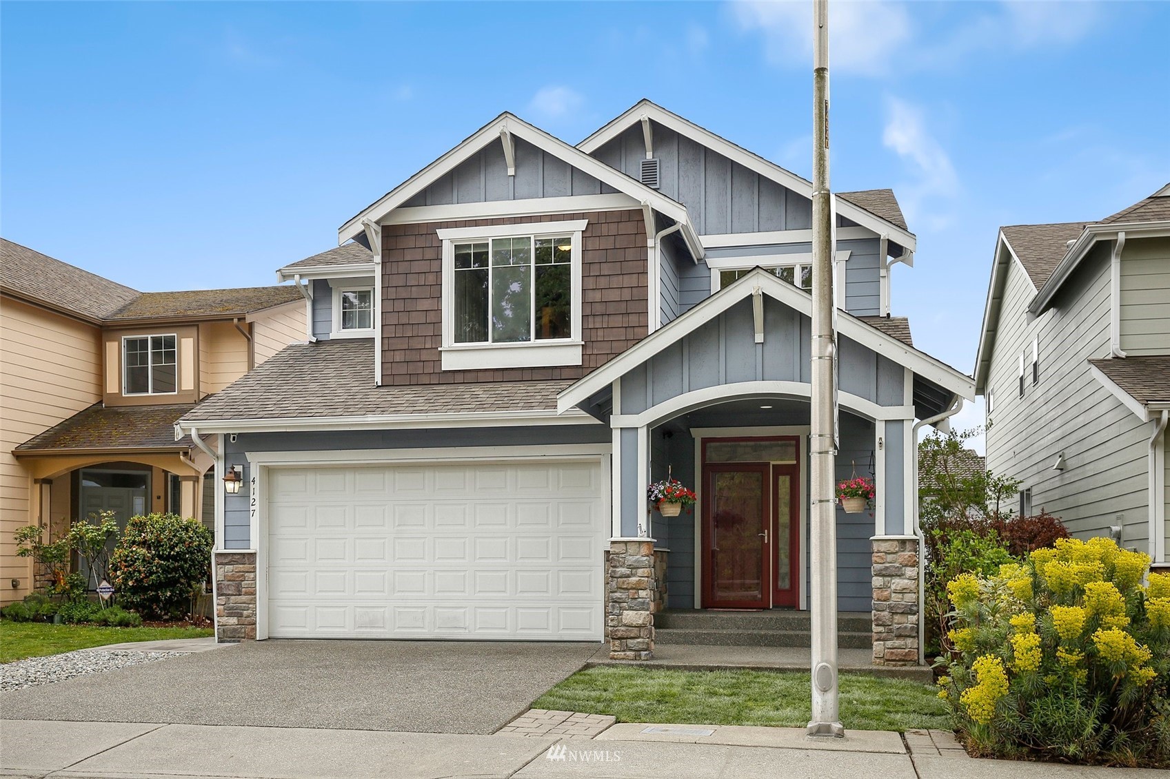 4127 Northeast 5th Court Renton, WA 98059 - Photo 35 of 36 a front view of a house with garden