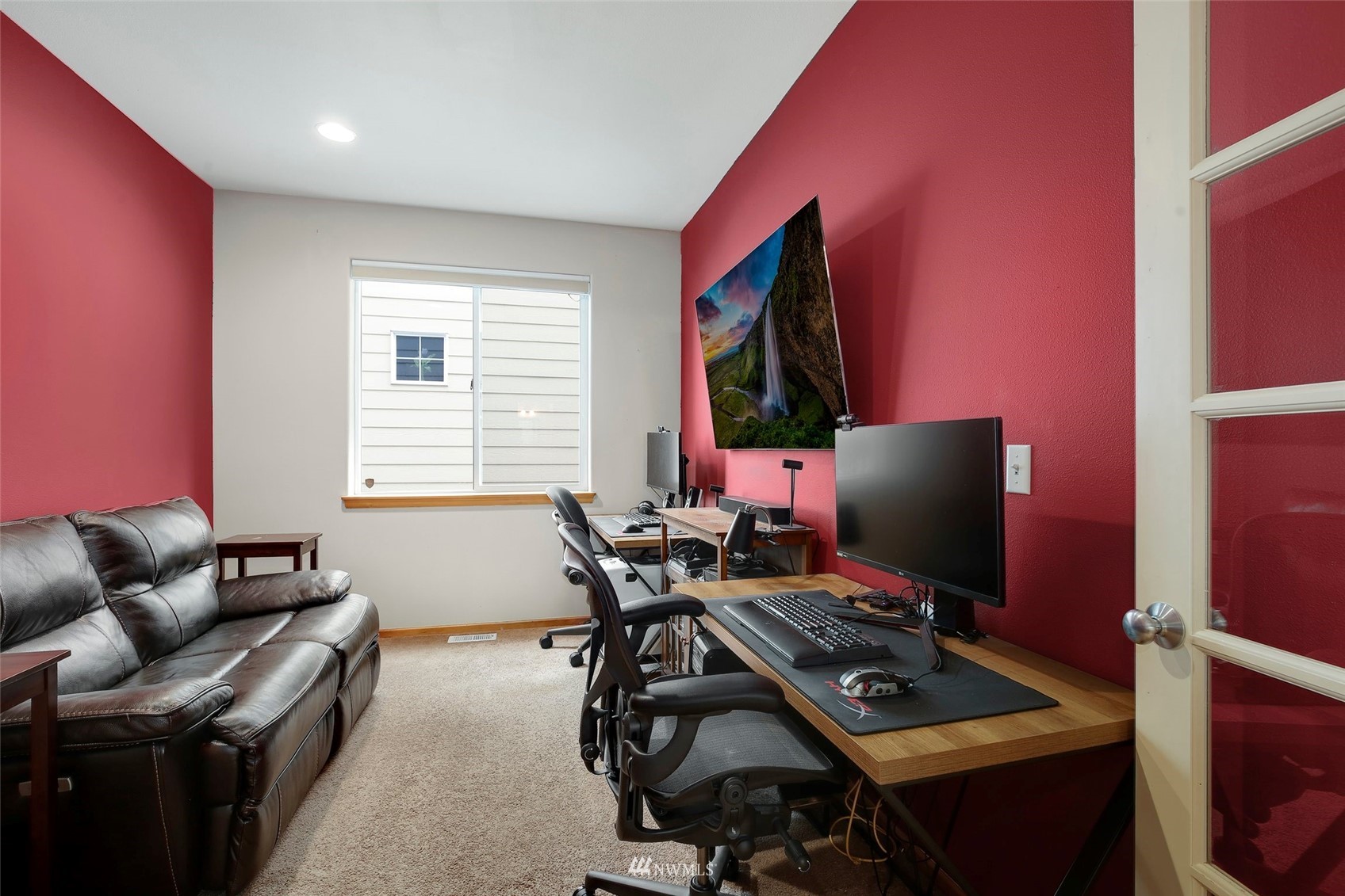 4127 Northeast 5th Court Renton, WA 98059 - Photo 4 of 36 a view of a workspace with furniture and a window