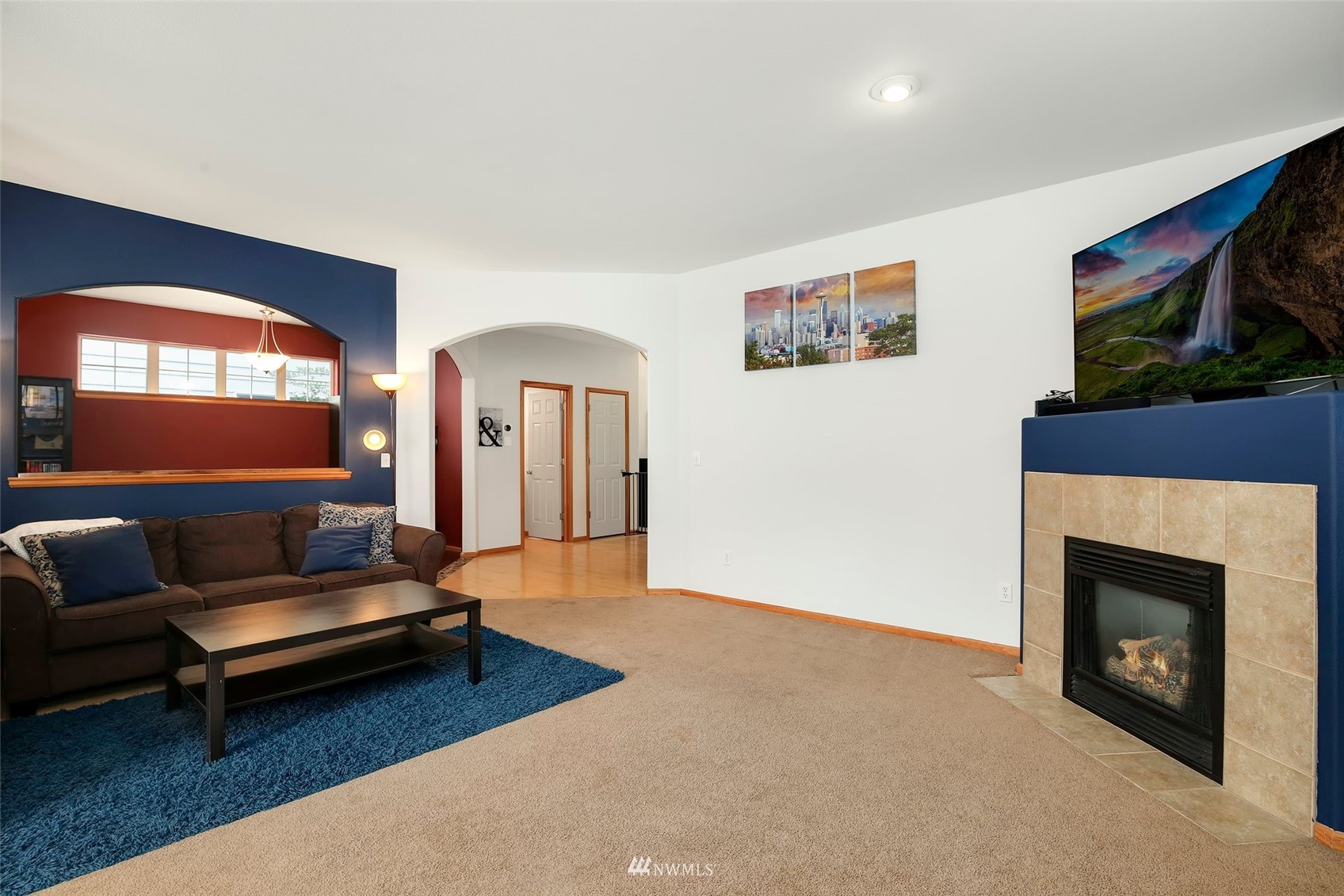 4127 Northeast 5th Court Renton, WA 98059 - Photo 6 of 36 a living room with furniture and a fireplace