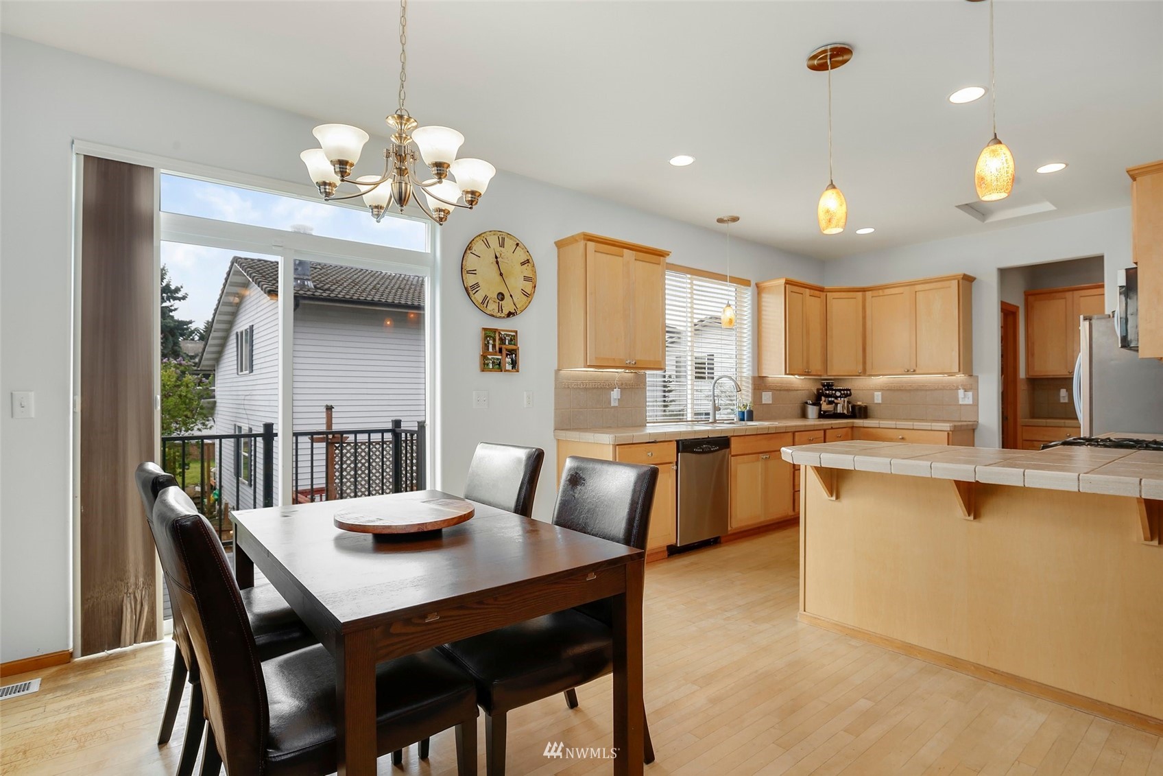 4127 Northeast 5th Court Renton, WA 98059 - Photo 9 of 36 a view of a dining room with furniture and chandelier