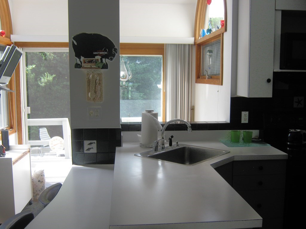 4 Old Salem Road Marblehead, MA 01945 - Photo 7 of 12 a kitchen with a sink and a stove top oven