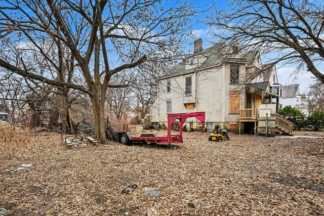 a view of a backyard with a snow and trees