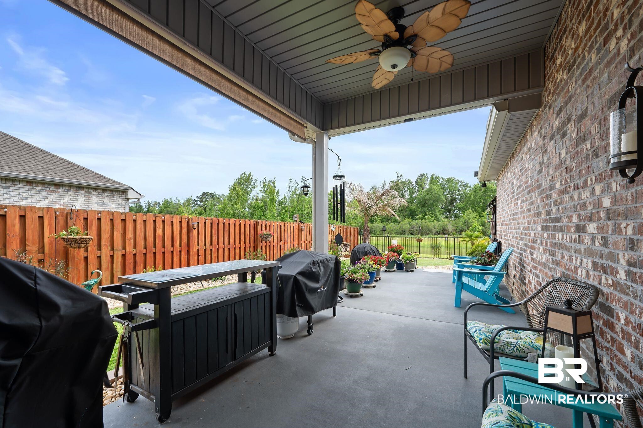 1165 Stella Road Foley, AL 36535 - Photo 40 of 42 View of patio / terrace with a fenced backyard, ceiling fan, area for grilling, and outdoor dining space