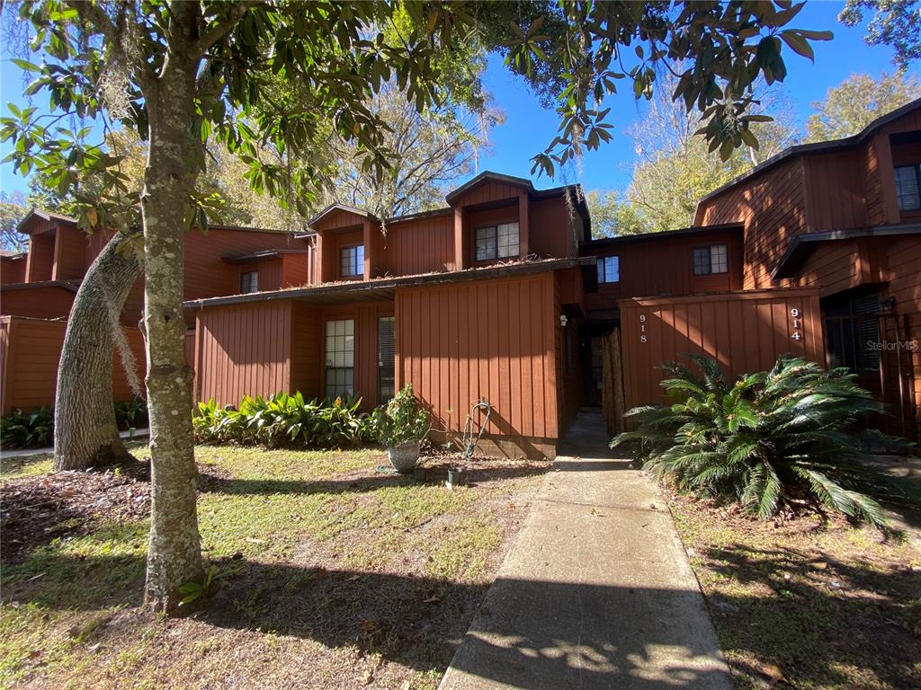 918 Southwest 56th Terrace Gainesville, FL 32607 - Photo 1 of 1 a front view of a house with garden
