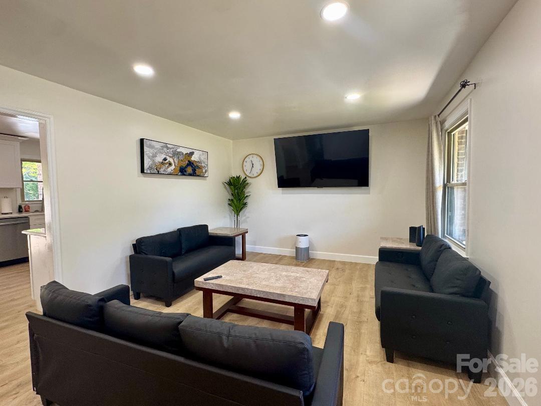168 Mooreland Road Mooresville, NC 28117 - Photo 11 of 32 a living room with furniture and a flat screen tv