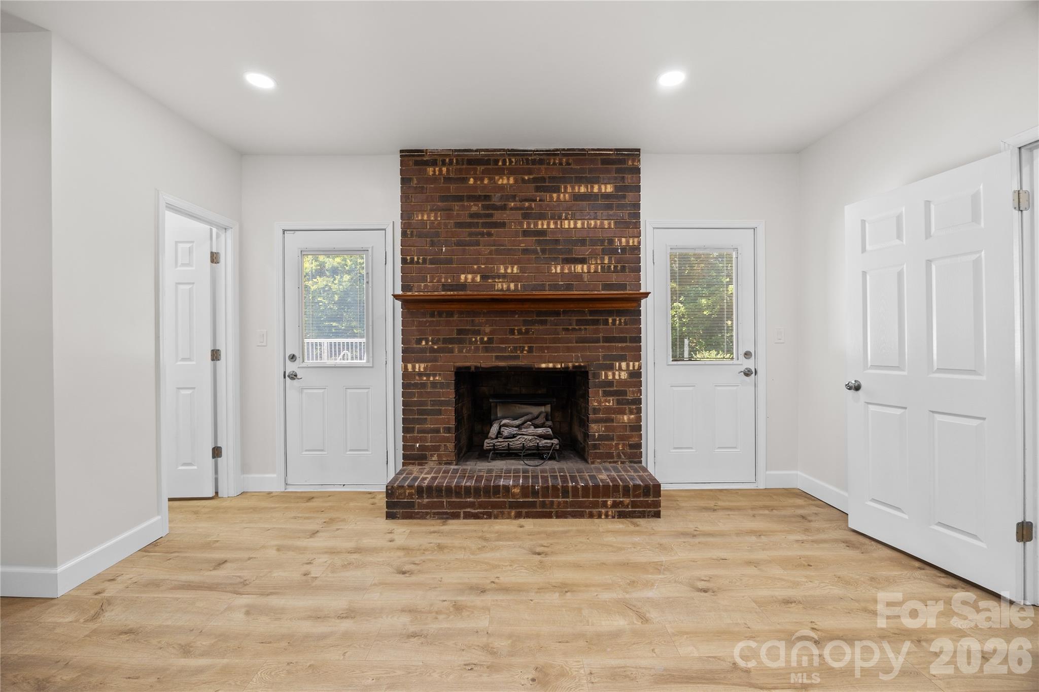 168 Mooreland Road Mooresville, NC 28117 - Photo 12 of 32 a view of an empty room with a fireplace