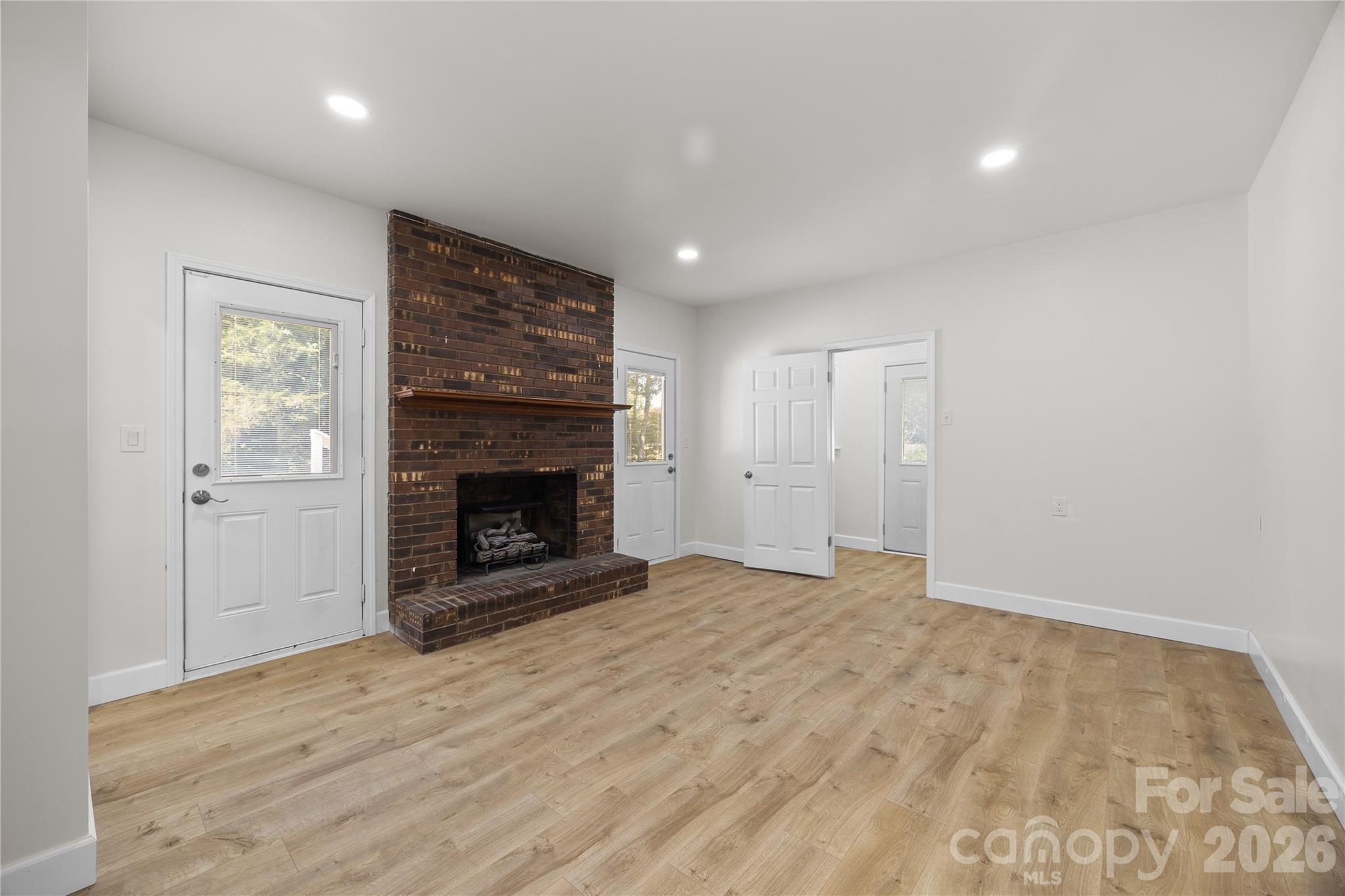 168 Mooreland Road Mooresville, NC 28117 - Photo 14 of 32 a view of an empty room with a fireplace
