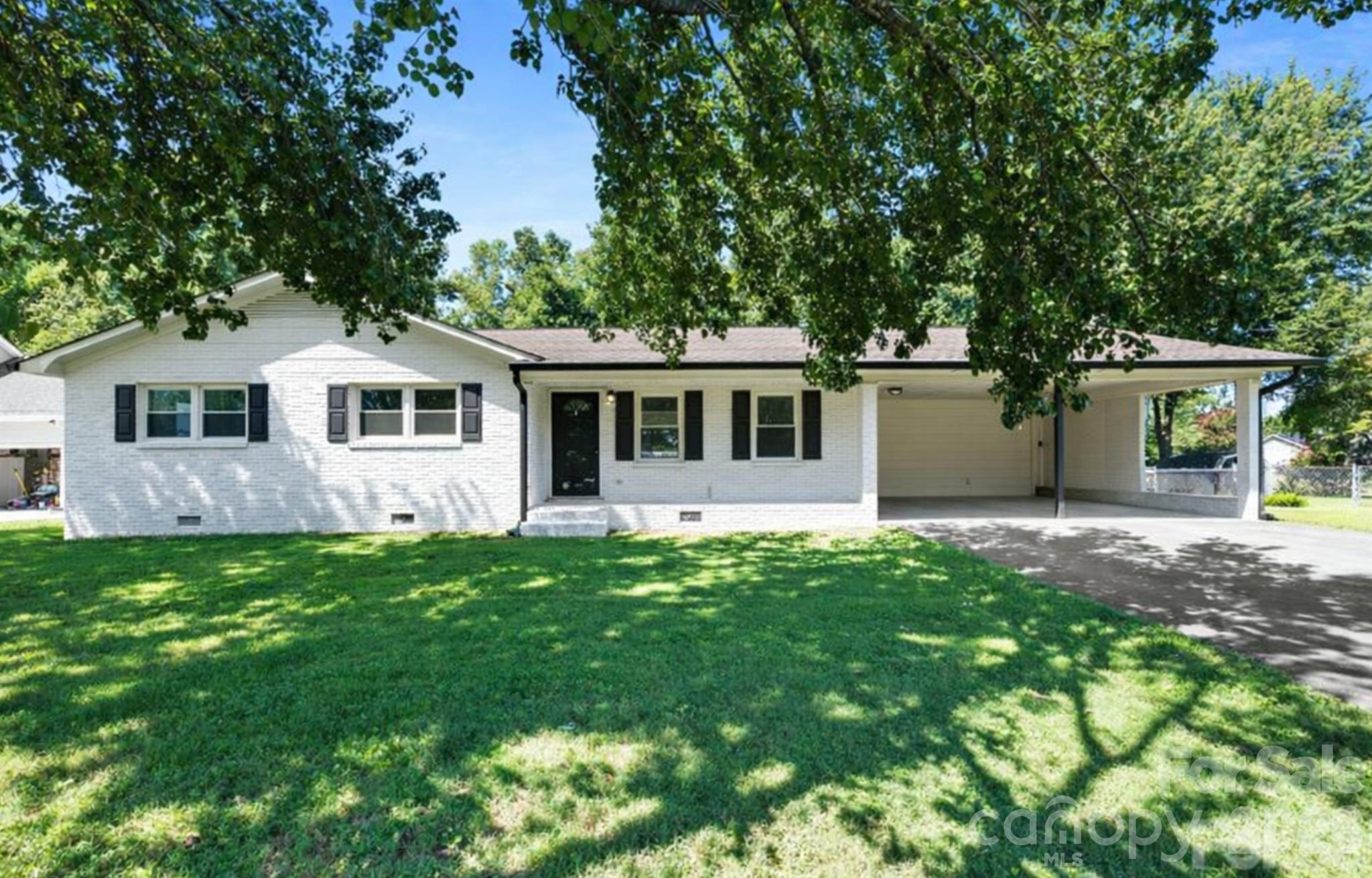 168 Mooreland Road Mooresville, NC 28117 - Photo 2 of 32 a front view of a house with a garden