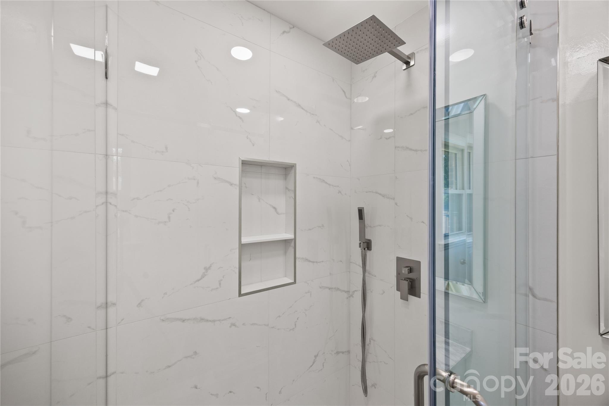 168 Mooreland Road Mooresville, NC 28117 - Photo 21 of 32 a bathroom with a glass shower door and a bathtub