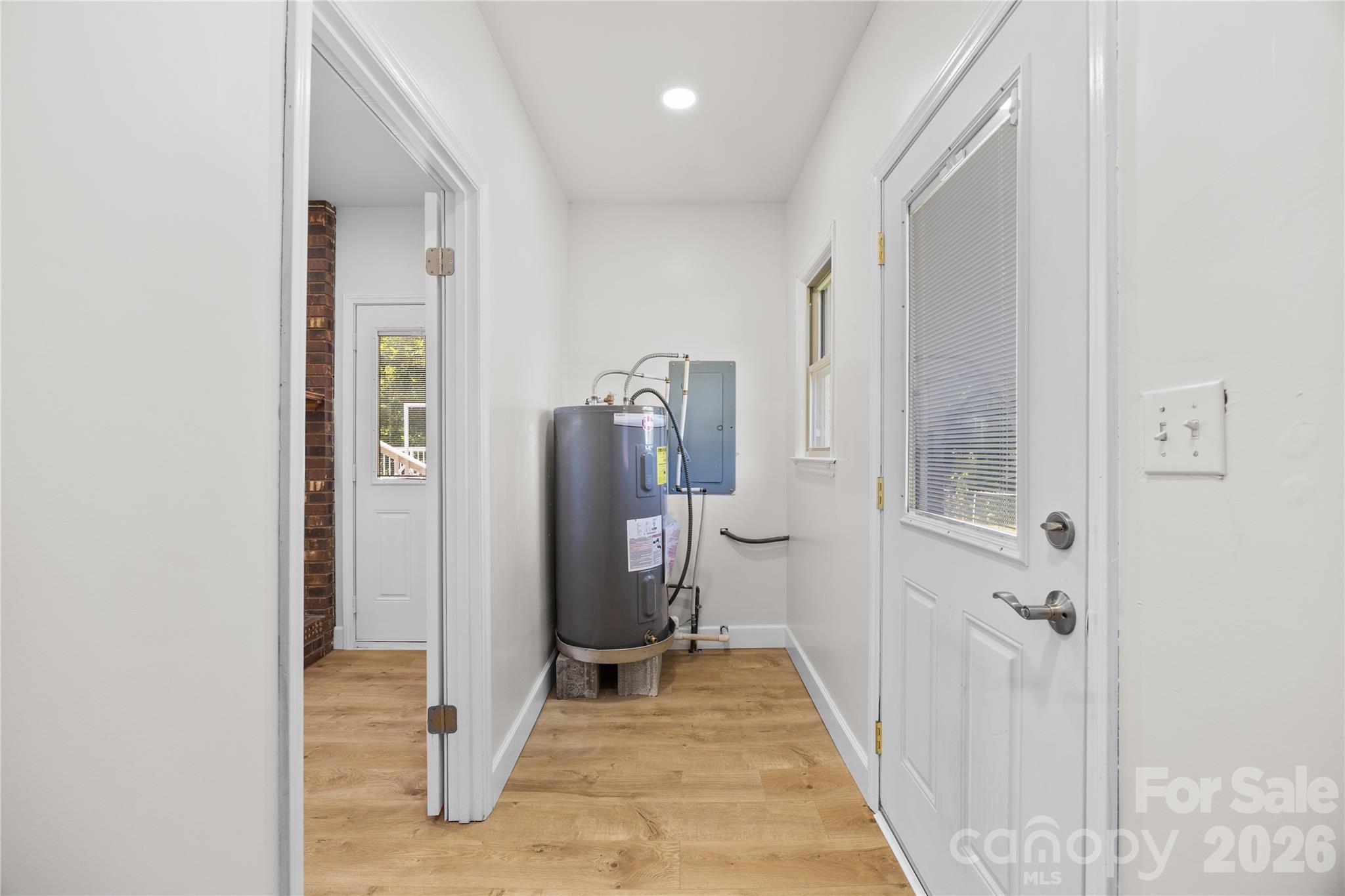 168 Mooreland Road Mooresville, NC 28117 - Photo 23 of 32 a view of a hallway with wooden shelves