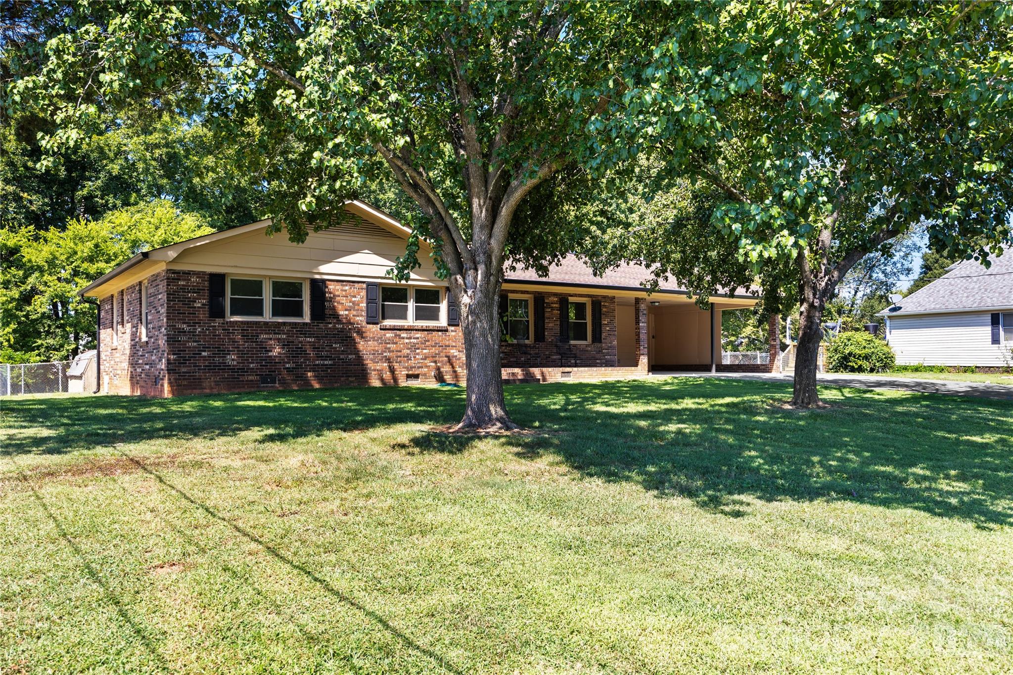 168 Mooreland Road Mooresville, NC 28117 - Photo 3 of 32 a front view of a house with a yard and garage