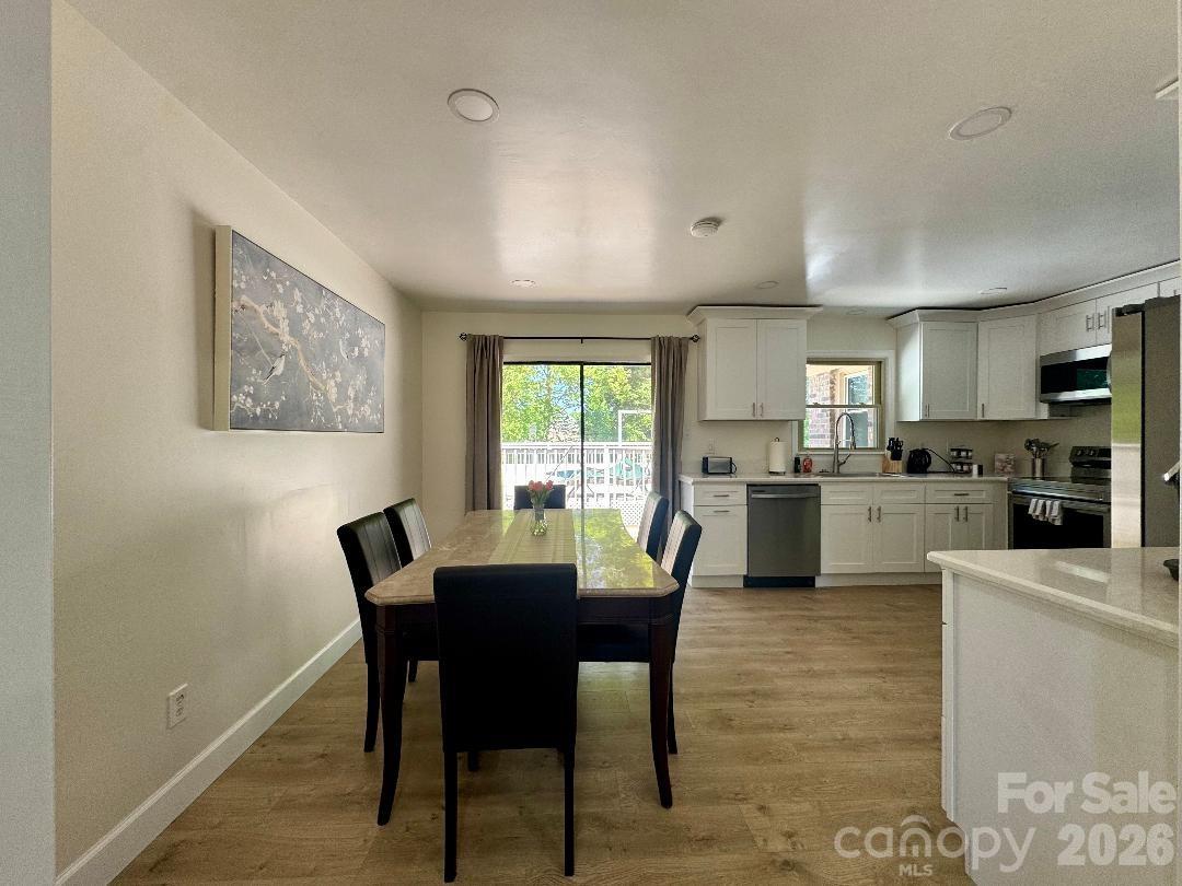 168 Mooreland Road Mooresville, NC 28117 - Photo 9 of 32 a view of a dining room with furniture and a window