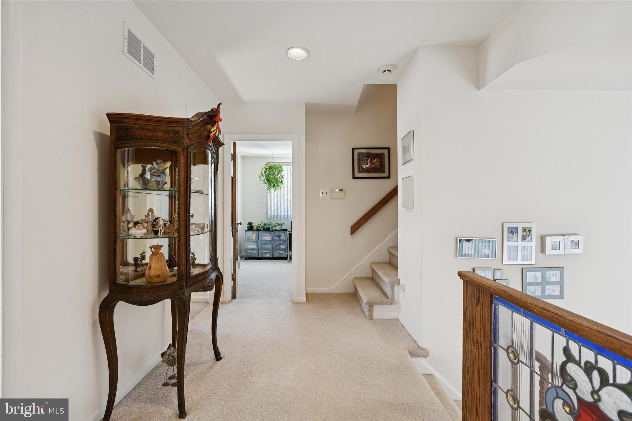 9204 Burbank Road Philadelphia, PA 19115 - Photo 15 of 43 a view of a hallway with wooden floor and stairs