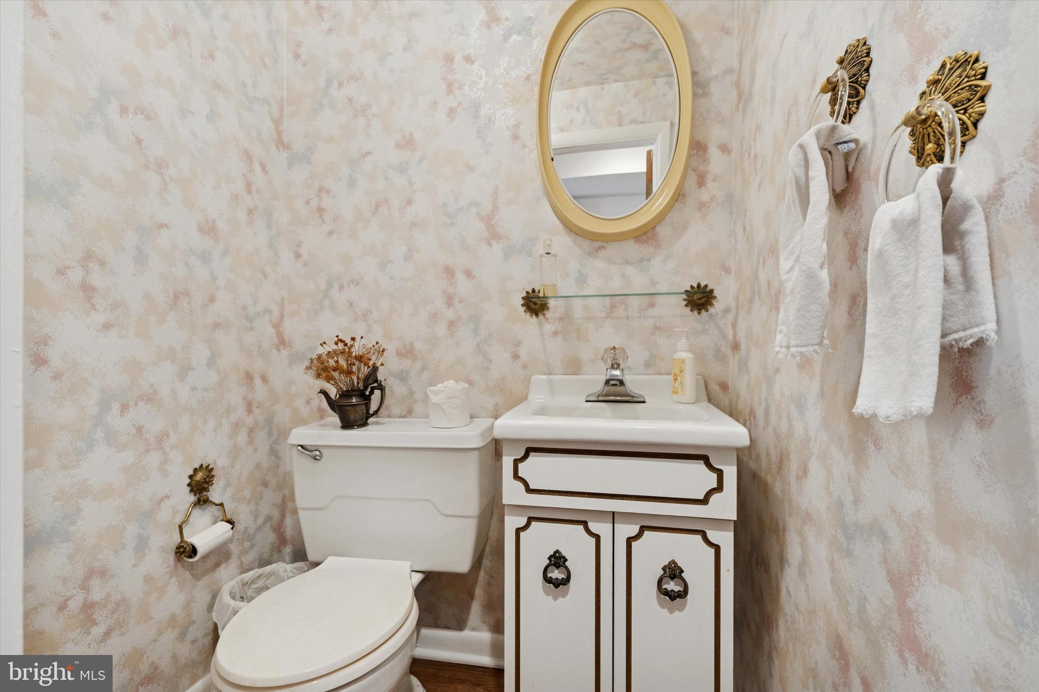9204 Burbank Road Philadelphia, PA 19115 - Photo 20 of 43 a bathroom with a sink a toilet and a mirror