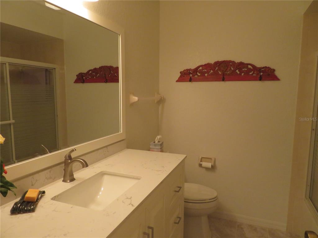 1360 Rio De Janeiro Avenue, Unit 117 Punta Gorda, FL 33983 - Photo 19 of 20 a bathroom with a sink and a toilet