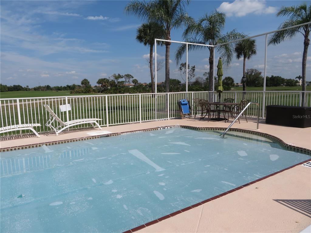 1360 Rio De Janeiro Avenue, Unit 117 Punta Gorda, FL 33983 - Photo 3 of 20 a view of a park with a bench