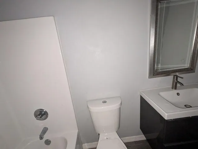 a bathroom with a sink and toilet
