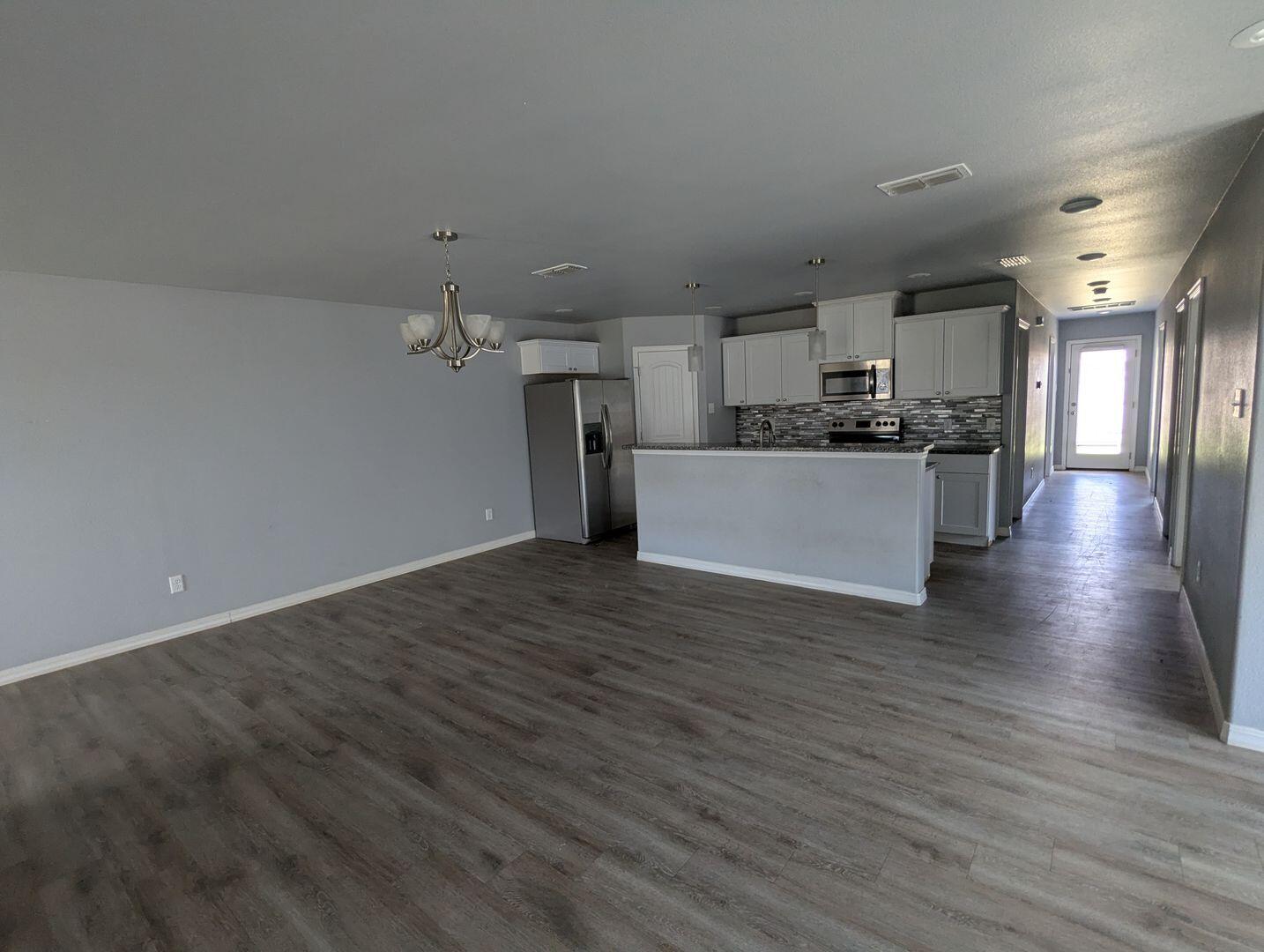 1302 North Clinton Avenue, Unit A & B Lubbock, TX 79416 - Photo 4 of 17 a view of a kitchen with a sink and a refrigerator