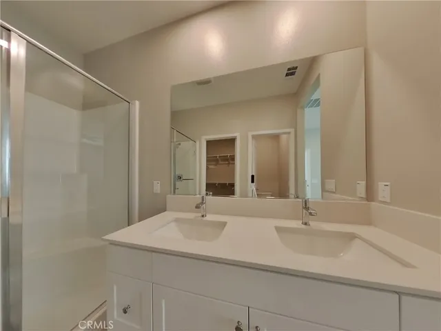 a bathroom with a sink and a large mirror