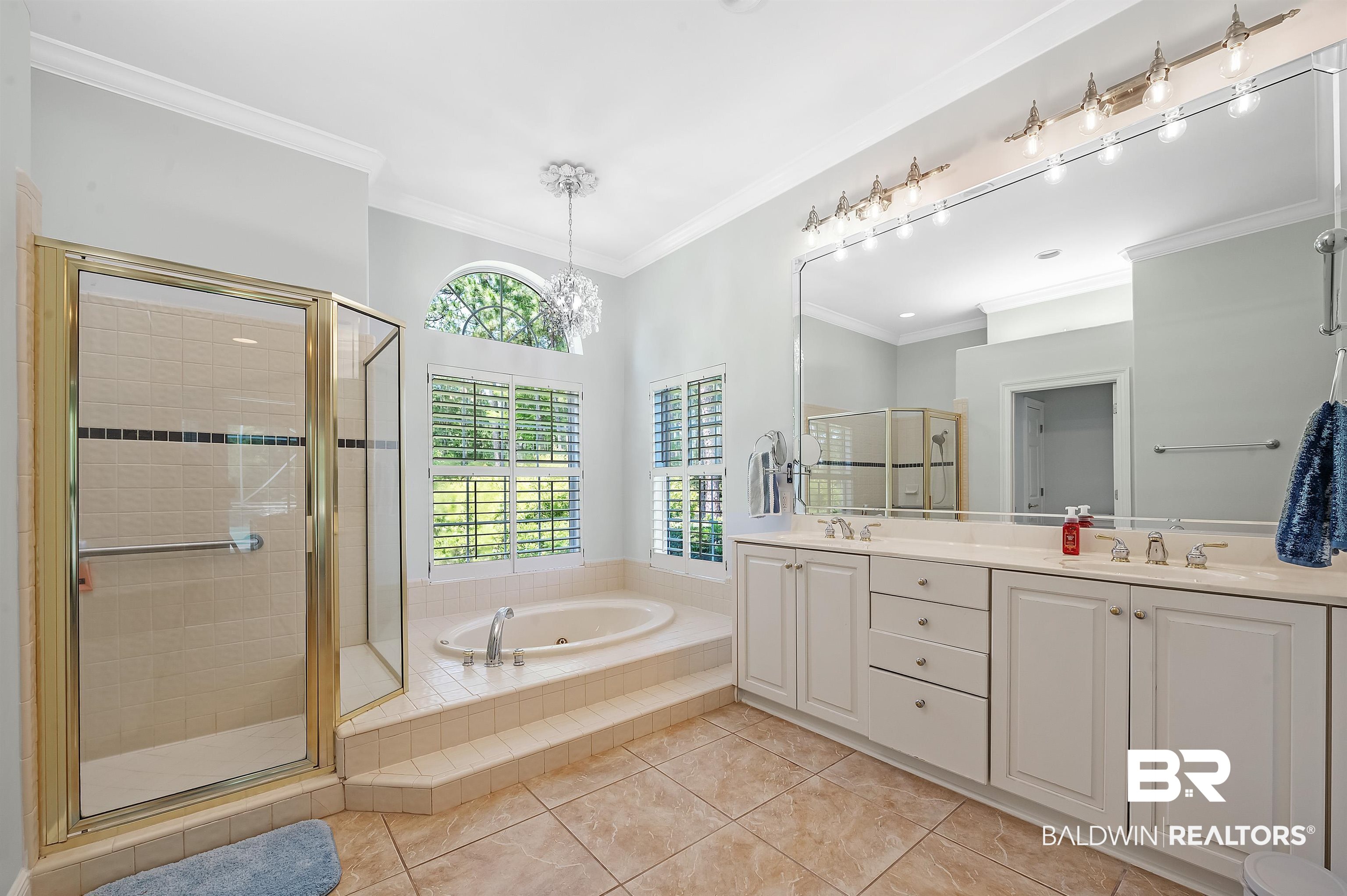 8160 Bay View Drive Foley, AL 36535 - Photo 25 of 43 Full bath with a shower stall, a bath, tile patterned flooring, double vanity, crown molding and double closets