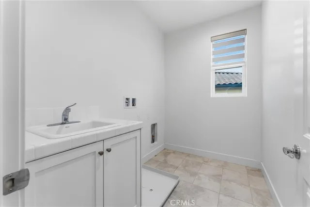 an empty room with windows and entryway