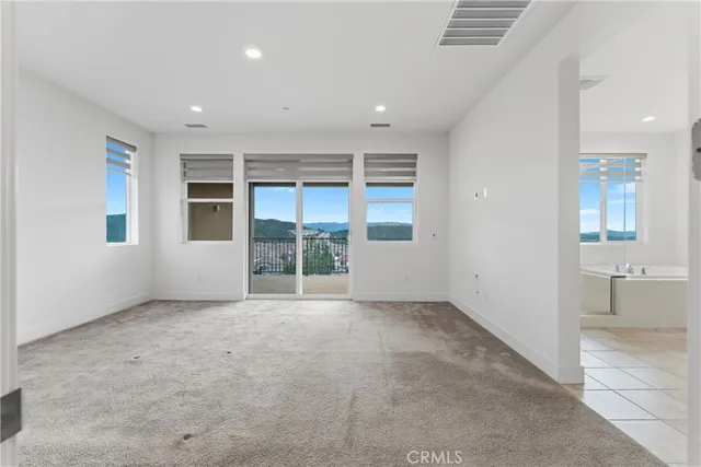 a spacious bathroom with a mirror a double vanity sink and shower
