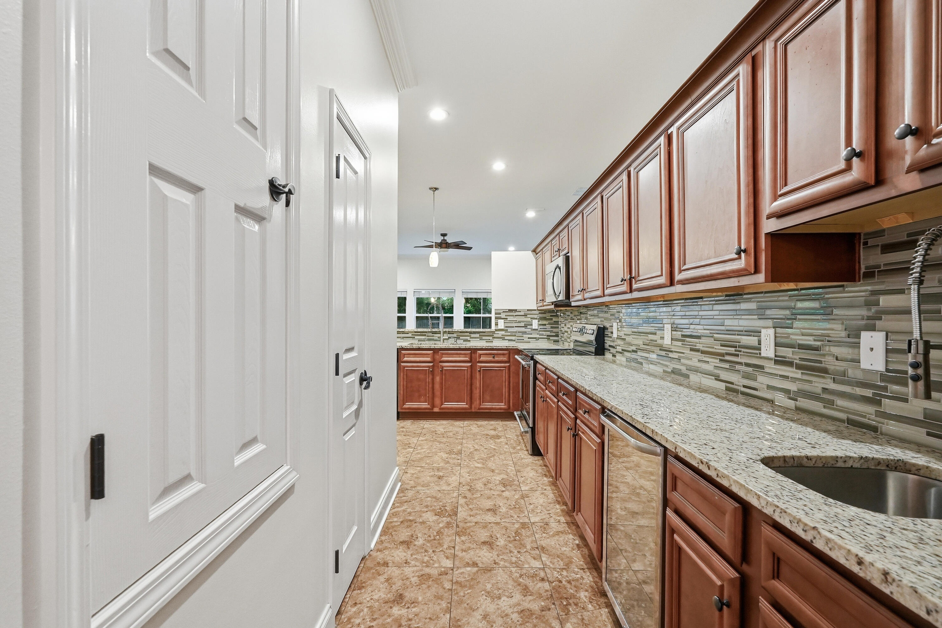 63 2nd Avenue Shalimar, FL 32579 - Photo 13 of 54 a kitchen with stainless steel appliances granite countertop a refrigerator and a sink