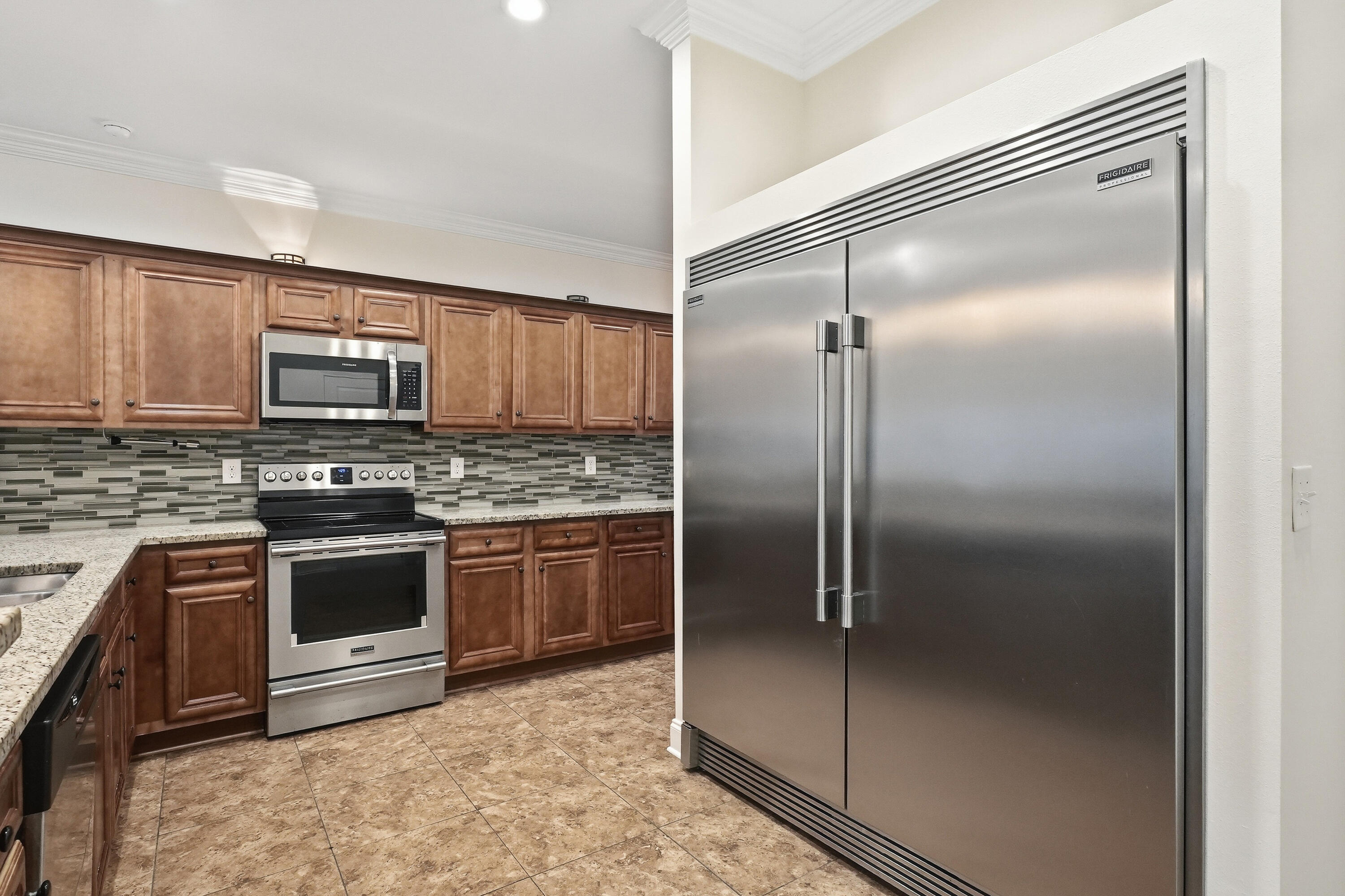 63 2nd Avenue Shalimar, FL 32579 - Photo 16 of 54 a kitchen with a refrigerator and a microwave