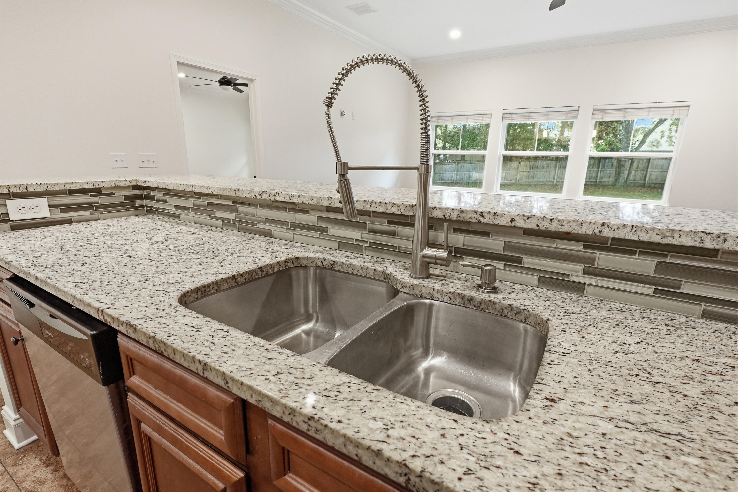 63 2nd Avenue Shalimar, FL 32579 - Photo 19 of 54 a kitchen with a sink and a granite top