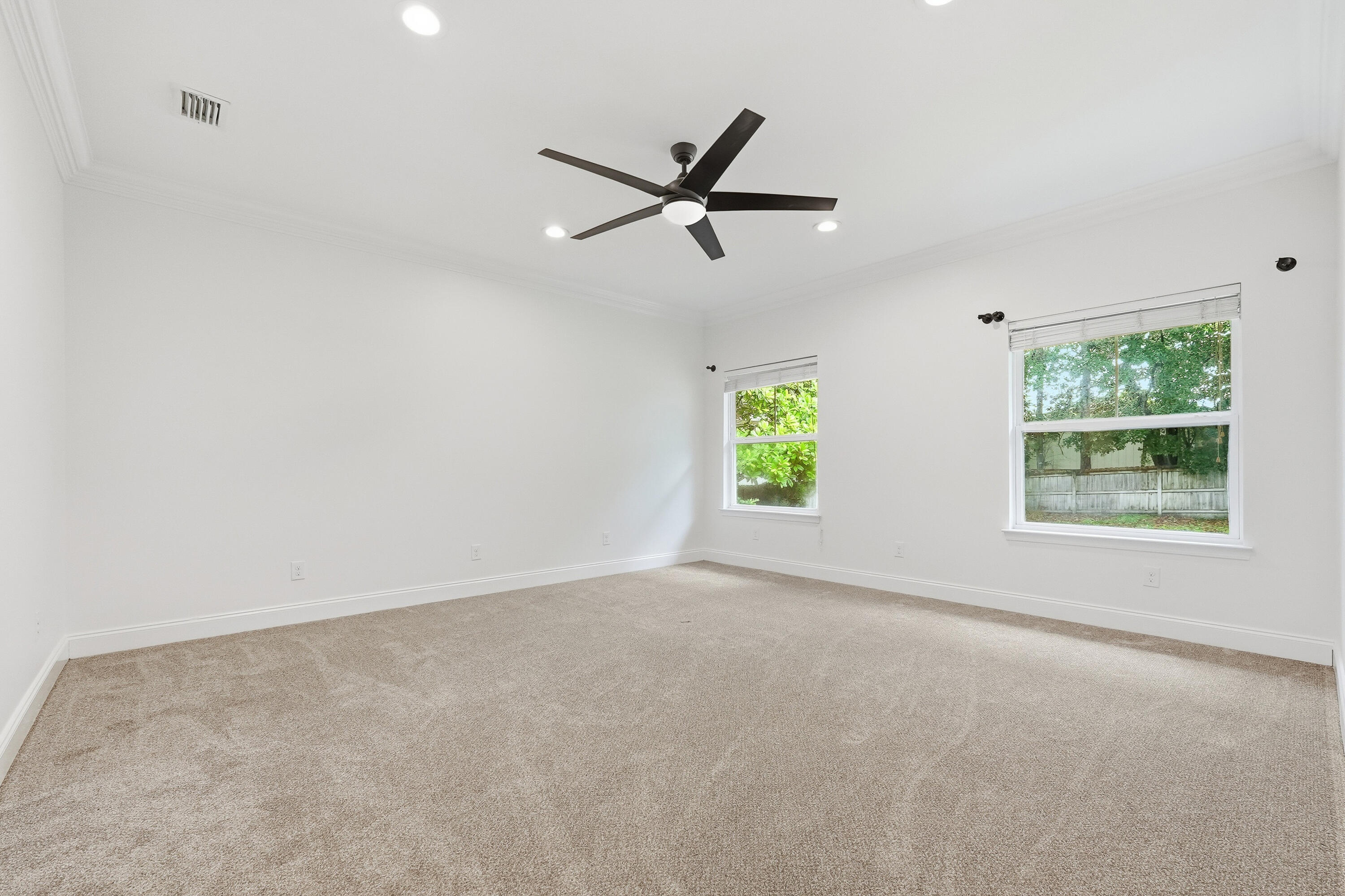 63 2nd Avenue Shalimar, FL 32579 - Photo 22 of 54 an empty room with windows and fan