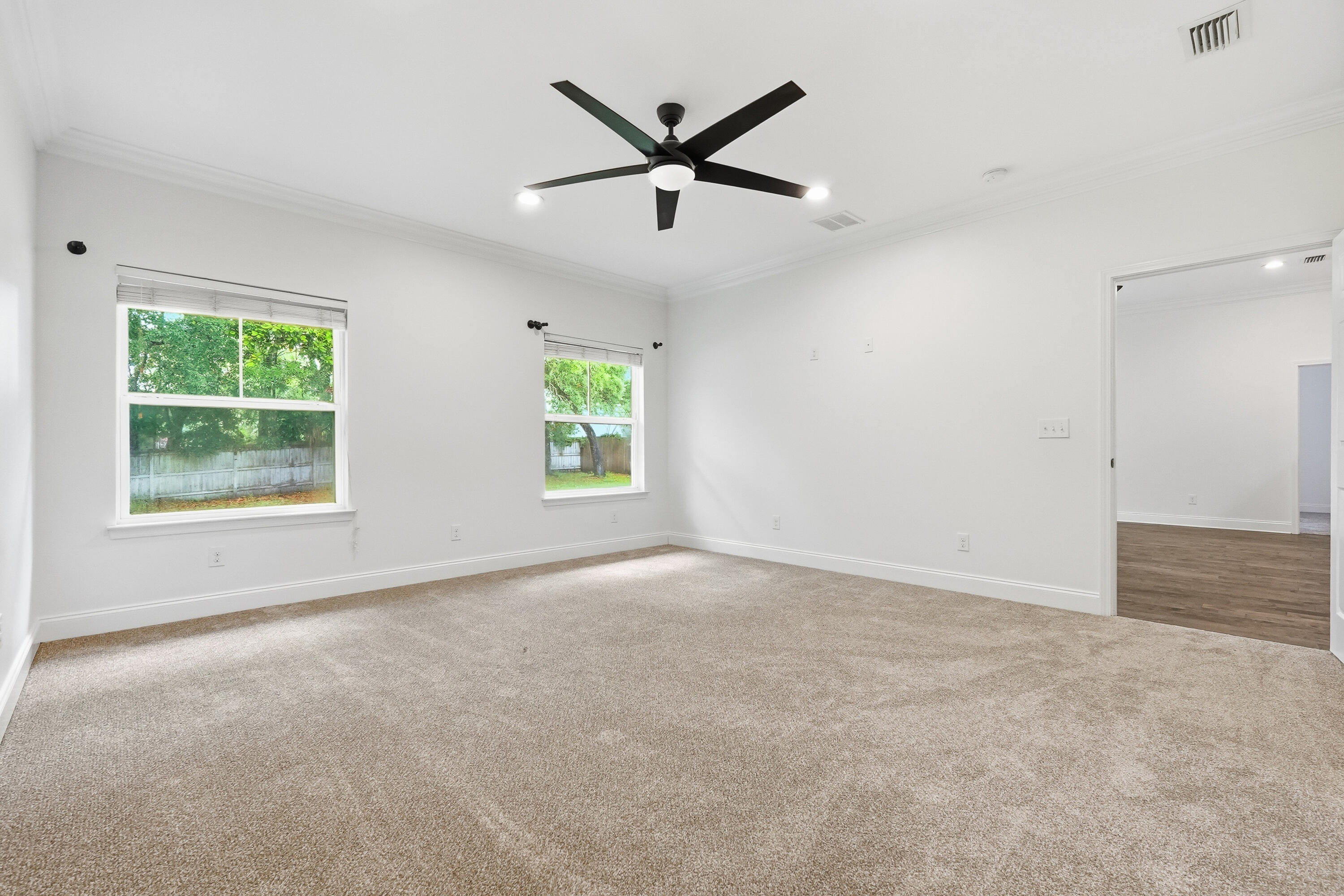 63 2nd Avenue Shalimar, FL 32579 - Photo 23 of 54 an empty room with windows and ceiling fan
