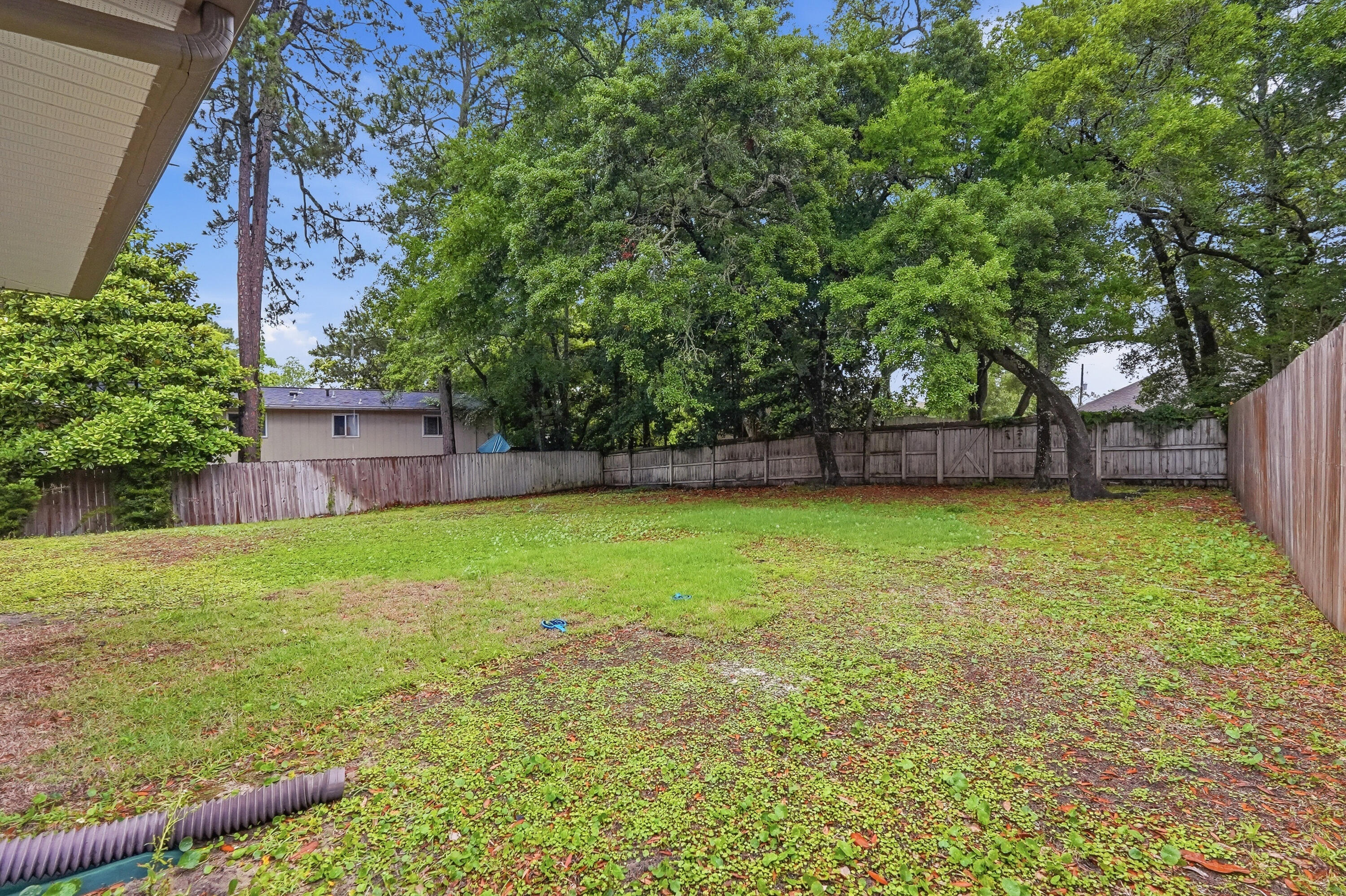 63 2nd Avenue Shalimar, FL 32579 - Photo 46 of 54 a view of a backyard with a large tree