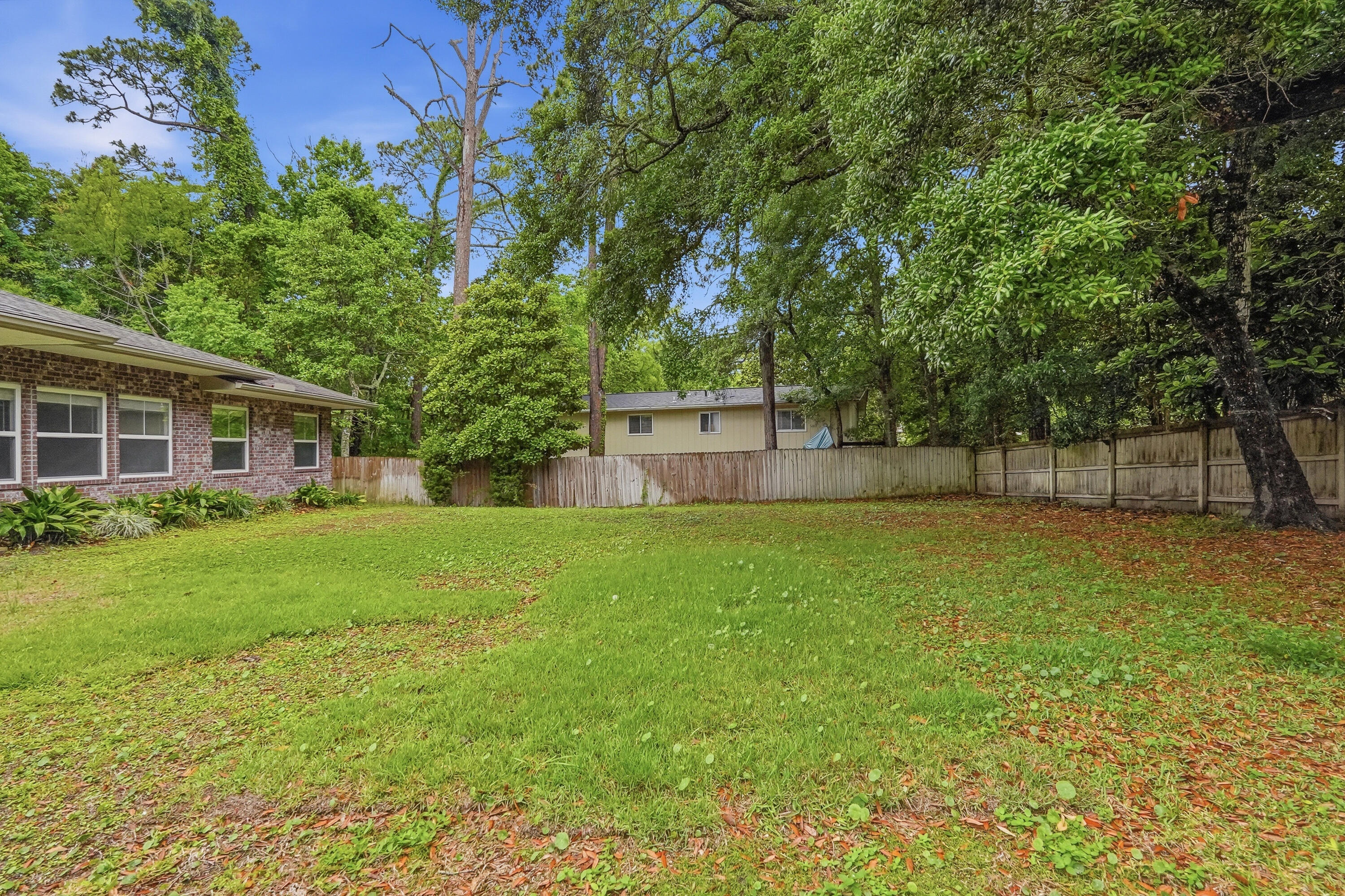 63 2nd Avenue Shalimar, FL 32579 - Photo 47 of 54 a view of a backyard with a garden