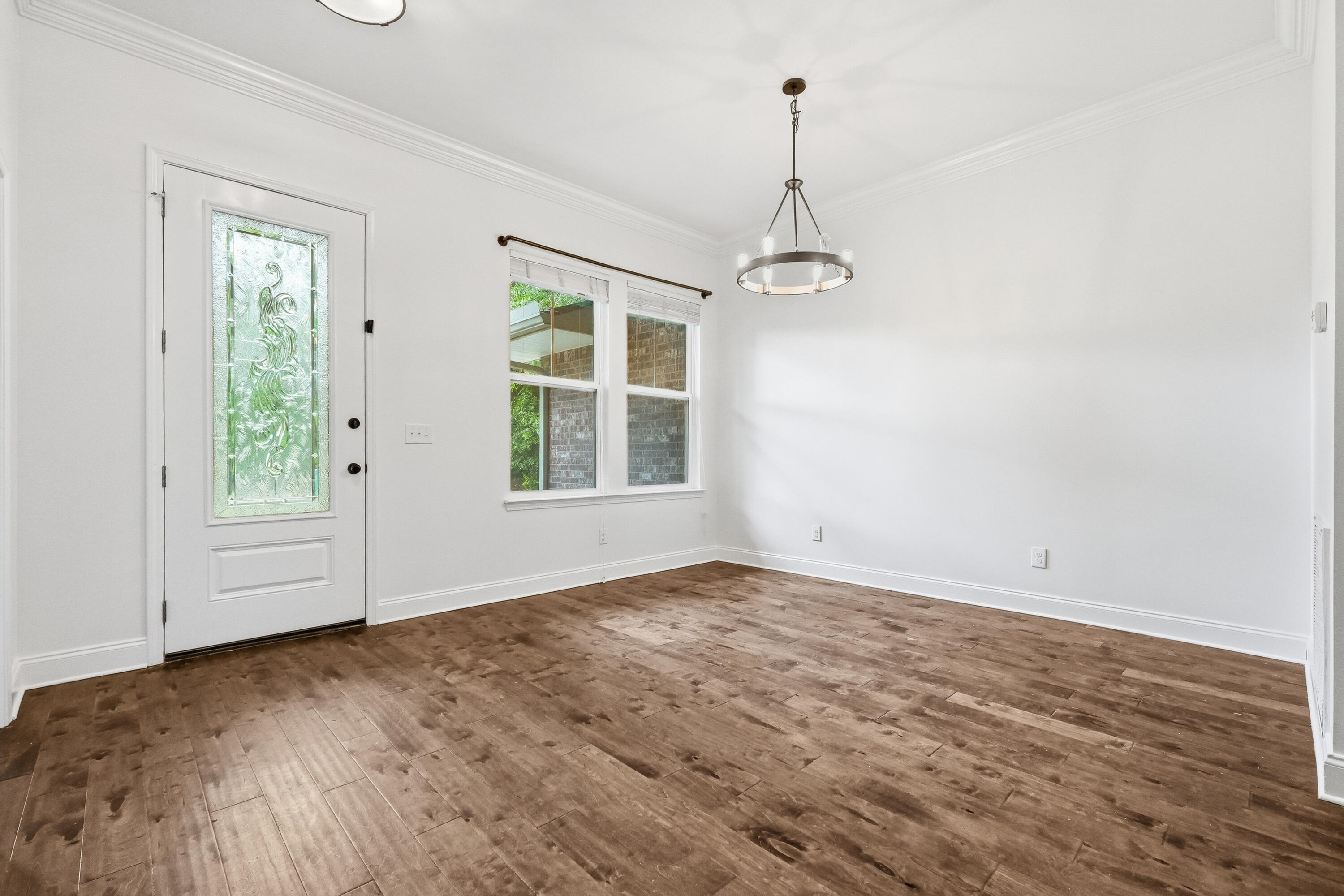 63 2nd Avenue Shalimar, FL 32579 - Photo 6 of 54 a view of empty room with wooden floor and windows