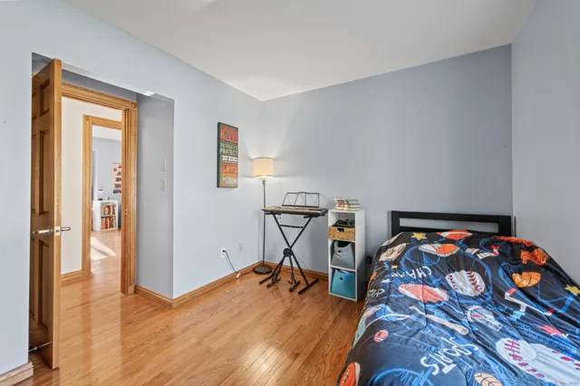 a bedroom with bed and a window