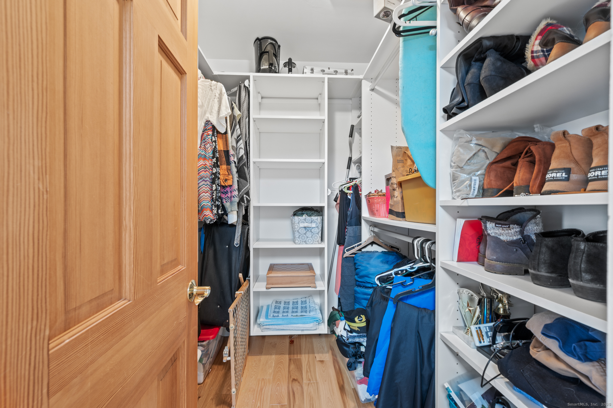 26 Farm View Drive Madison, CT 06443 - Photo 25 of 37 a view of walk in closet with clothes and shoes