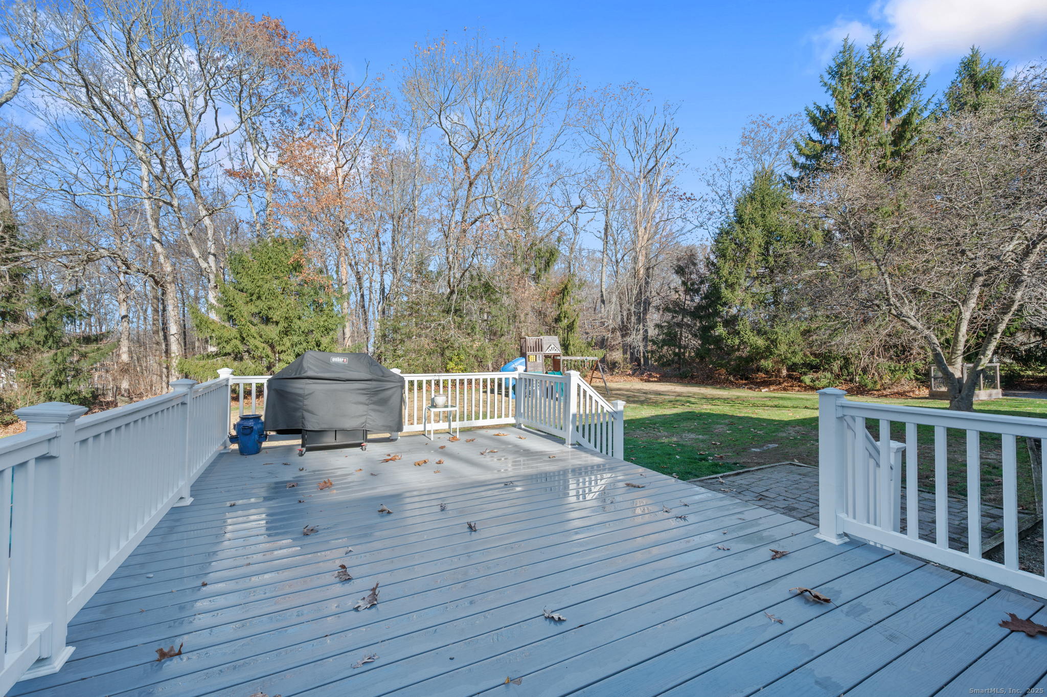 26 Farm View Drive Madison, CT 06443 - Photo 34 of 37 a view of a deck with chairs and wooden floor