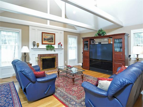 15 Hastings Road Weston, MA 02493 - Photo 11 of 21 a living room with furniture a flat screen tv and a fireplace