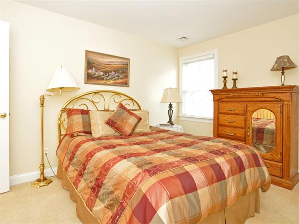 15 Hastings Road Weston, MA 02493 - Photo 14 of 21 a bedroom with a bed and a dresser