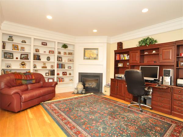 15 Hastings Road Weston, MA 02493 - Photo 6 of 21 a living room with furniture and a fireplace