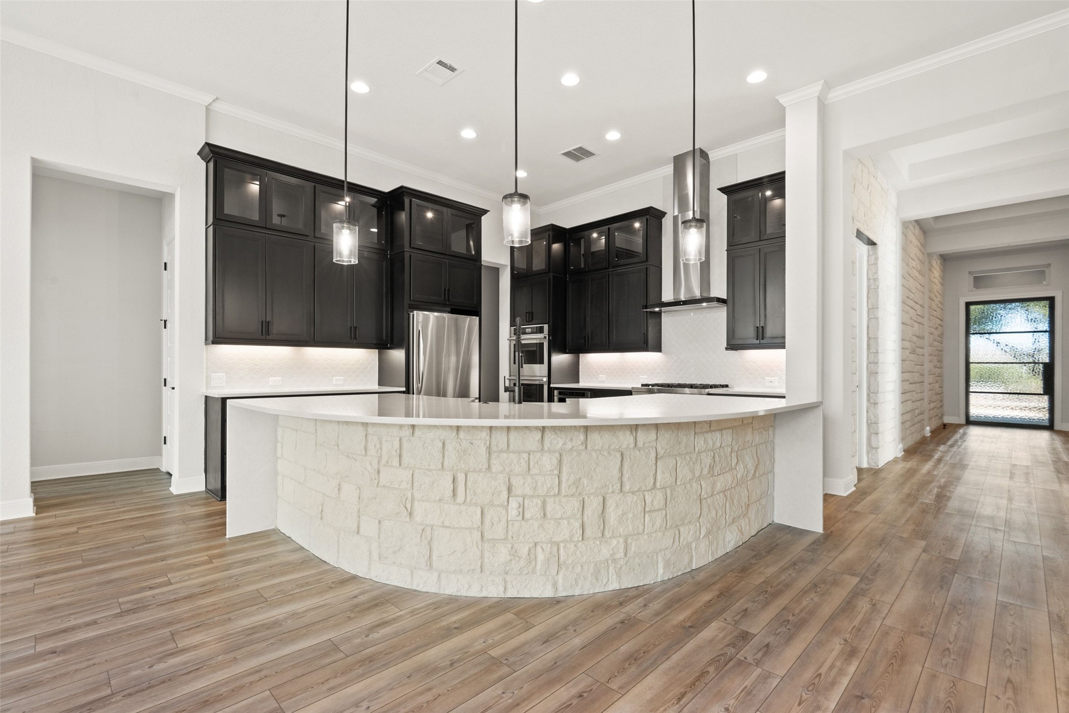 5420 Destination Way Jonestown, TX 78645 - Photo 3 of 39 Elevated and Upgraded kitchen overlooking the open entertaining space and out to the beautiful and private backyard.