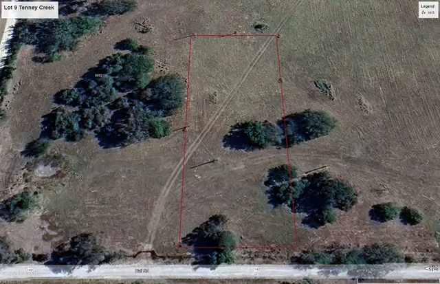 a view of a backyard with a fountain