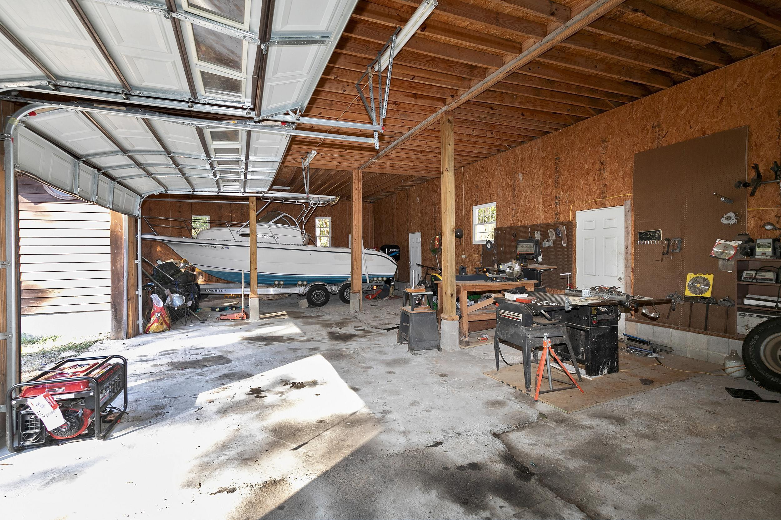 1300 Major Slade Road Wendell, NC 27591 - Photo 28 of 30 Large oversized 4 car garage with ample workshop area! Large Workshop - Garage