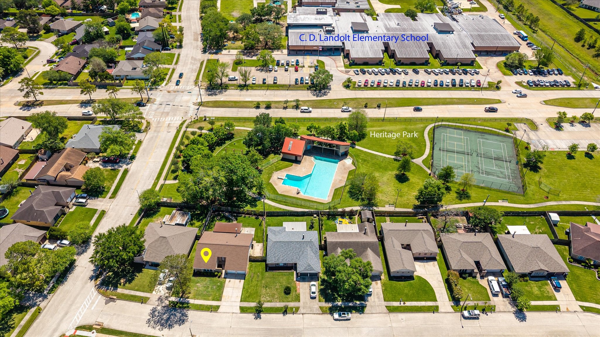 2507 Kings Chapel Road Friendswood, TX 77546 - Photo 26 of 28 This aerial highlights the home’s location directly across from Landolt Elementary, offering a convenient option for daily routines. The surrounding neighborhood layout shows easy access to nearby streets and amenities.
