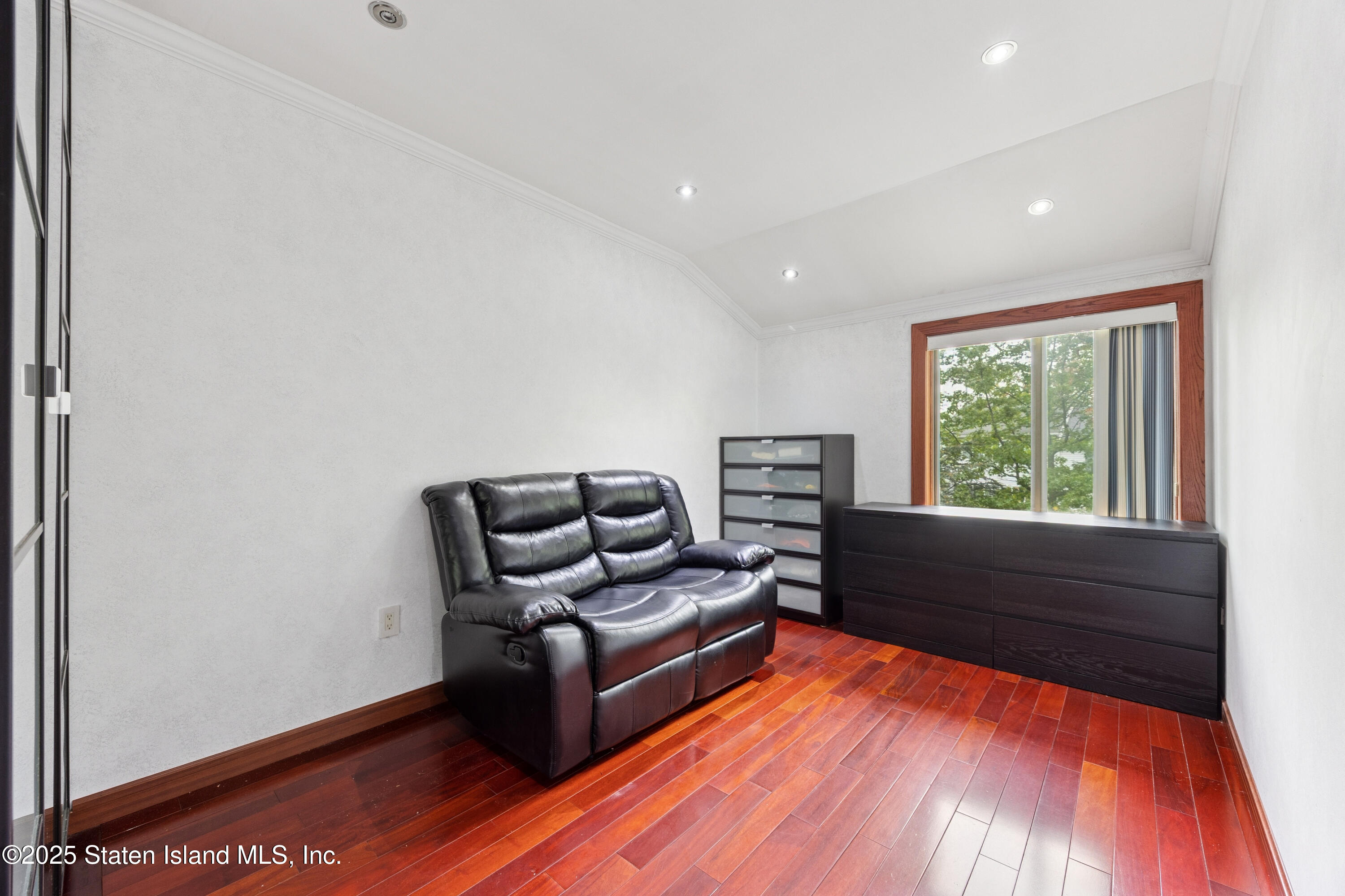 192 Ilyssa Way Staten Island, NY 10312 - Photo 12 of 25 a living room with furniture and a wooden floor